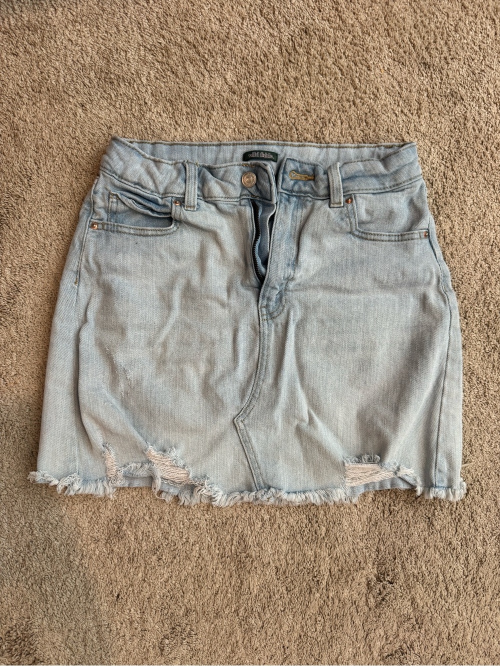 Distressed denim mini skirt